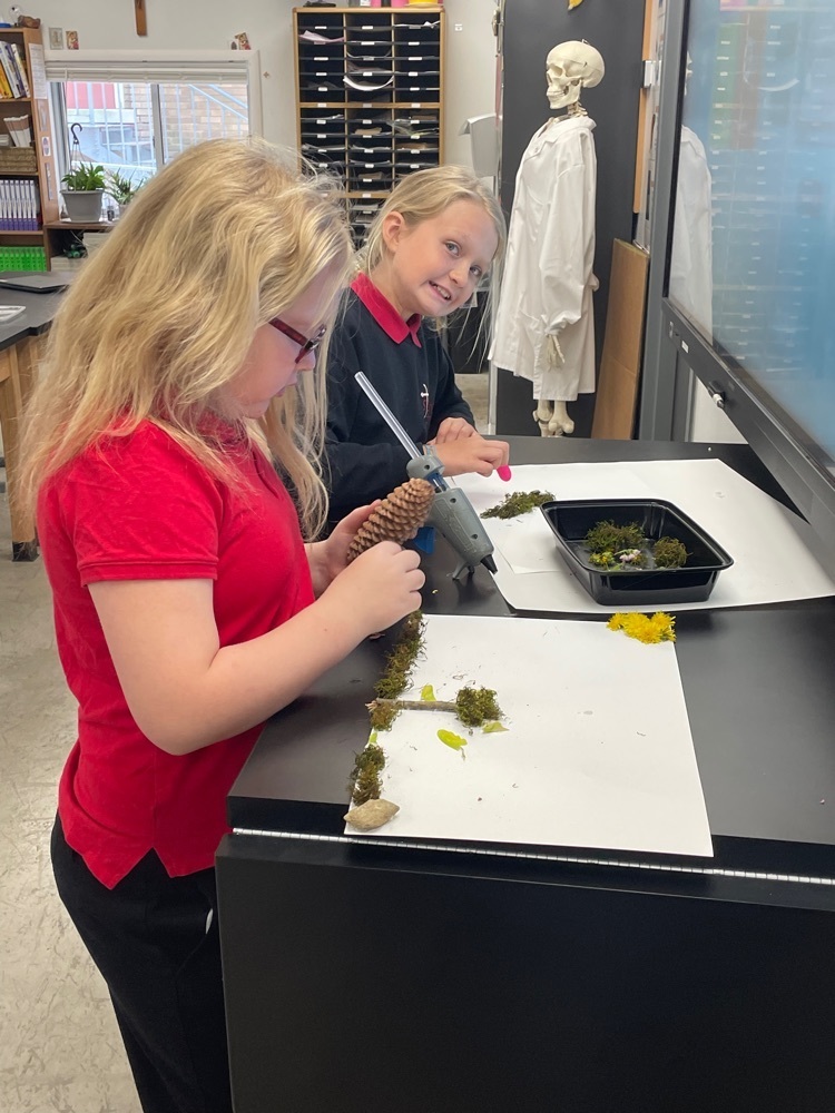 Emma creating and Bryn working on her gorgeous moss horse “Blossom”